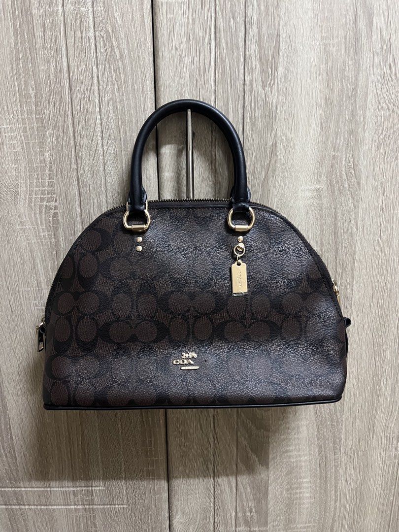 Coach Signature Canvas Monogram Dome Katy Satchel Bag (Category: Luxury Bags & Wallets) located in Cebu City. Submitted by seokjin. (Listing ID 1449638024, Image 1). Description: Coach Katy Satchel Bag - Top handles and detachable shoulder strap - Includes (stained) dust bag and care card - The bag is in really good condition as in hindi pa talaga nagamit this was only stored, the only issue is that some letters of the logo snapped off 🥹 and idk