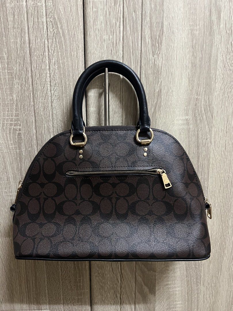 Coach Signature Canvas Monogram Dome Katy Satchel Bag (Category: Luxury Bags & Wallets) located in Cebu City. Submitted by seokjin. (Listing ID 1449638024, Image 2). Description: Coach Katy Satchel Bag - Top handles and detachable shoulder strap - Includes (stained) dust bag and care card - The bag is in really good condition as in hindi pa talaga nagamit this was only stored, the only issue is that some letters of the logo snapped off 🥹 and idk