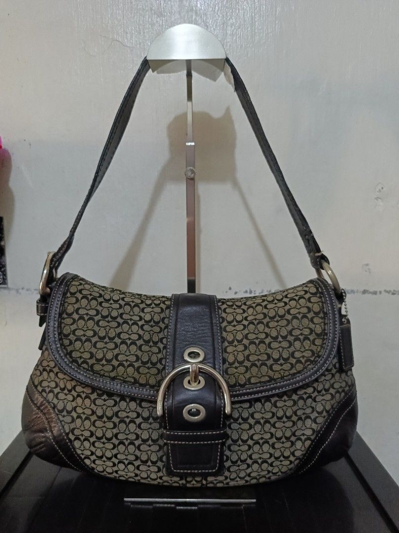 Coach Soho F10926 Black Medium (Category: Luxury Bags & Wallets) located in Tagum. Submitted by reyz.18 (Listing ID 1449590602, Image 1). Description: •Canvas and inner lining are in good condition •Flaws in strap as it is cracked and has tears •Has hairlines in strap rubber lining and bit damaged rubber lining on the side flap •Hardware is 6/10 •Has creed, hangtag,ykk zip, dustbag •RANK AB •Guranteed authentic •All is good except for strap, rubb