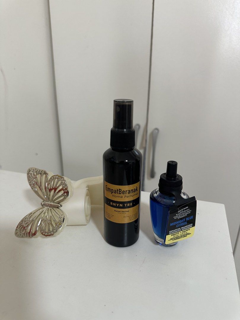 (COMBO) Bath & Body Works Wallflower Fragrance (Category: Fragrance & Deodorants) located in Rawang. Submitted by harazn (Listing ID 1449604764, Image 1). Description: - NEW Empat Beranak Home Perfume (Banyan Tree Hotel Series) - Bath & Body Works fragrance (Midnight Blue Citrus) - Decorative butterfly plug-in warmer included.