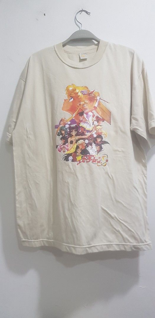 Sailor moon Cream T-shirt new old stock (Category: Other Tops) located in Petaling Jaya. Submitted by jesbirkaur71 (Listing ID 1449679363, Image 2). Description: - Cream colored t-shirt 1994 sailor moon movie print -details on this is in last 2 pictures - Features a large, colorful graphic print of anime characters on the front - Ideal for anime enthusiasts - not used but kept long and have bit stain from kept long - Suitable for casual everyday 