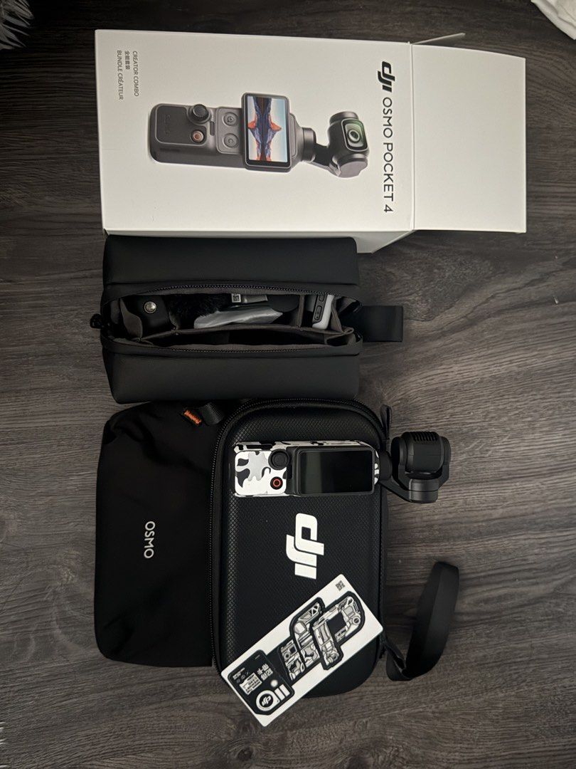 DJI Osmo Pocket 4 Creator Combo with Accessories (Category: Video Cameras) located in Imus. Submitted by mrdezz (Listing ID 1449736493, Image 3). Description: DJI Osmo Pocket 4 Creator Combo - Ideal for vlogging and travel content creation - Comes with the Osmo Pocket camera and its gimbal - Includes essential accessories: microphone, tripod, and charging adapter - All items fit neatly into included carrying cases - Selling due to an upgrade - Fe