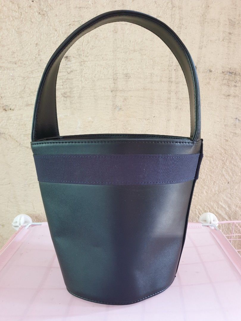 Ferragamo Leather Bucket Bag (Category: Luxury Bags & Wallets) located in Las Pinas. Submitted by anggesmart (Listing ID 1449547529, Image 3). Description: Preloved Salvatorre Ferragamo Vara Bucket Bag. Comes in black leather with iconic Vara bow in gold hardware & navy blue trimming. Single top handle with interior zippered compartment. Compliments any outfit, stylish & classy! pls manage expectations, with signs of usage.