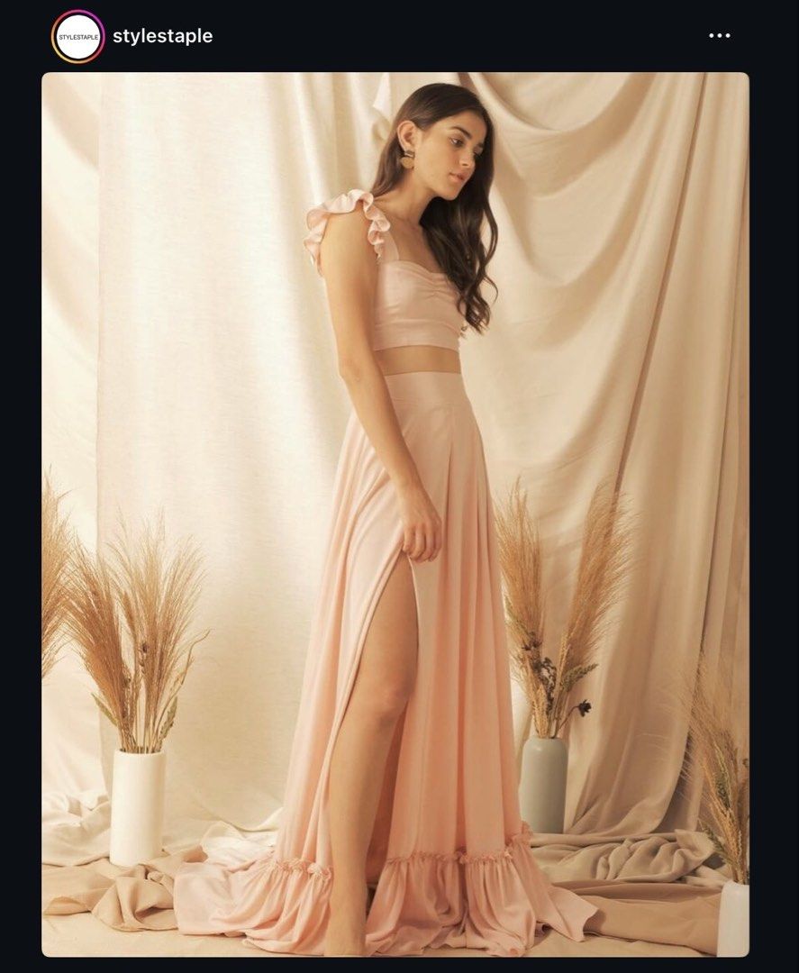 [FOR RENT] Style Staple “Aurora” Coords (Category: Sets or Coordinates) located in Las Pinas. Submitted by rerack (Listing ID 1449631572, Image 1). Description: AURORA Ruffle Crop Top & High Slit Skirt Coords by Style Staple — FOR RENT Color: Blush Size: Small Elegant two-piece set featuring a ruffle-strap cropped bustier top paired with a flowy high-slit maxi skirt with ruffled hem detail. Perfect for weddings, prenup shoots, garden events, or b