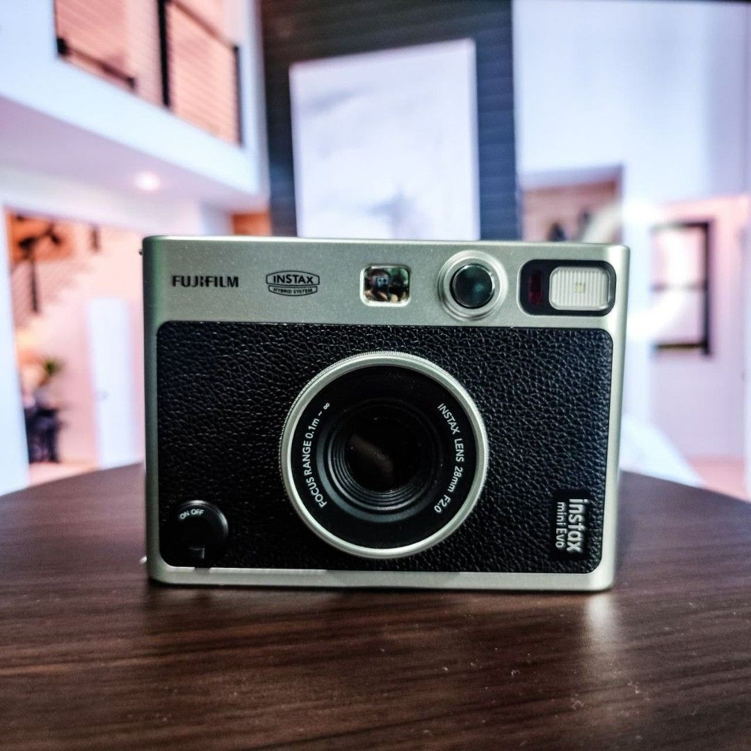 Fujifilm Instax Mini Evo Instant Camera with Case (Category: Cameras) located in Quezon City. Submitted by j.mrrn (Listing ID 1449687849, Image 3). Description: No issues fully functional. With newly bought film for testing for sure buyer. Cosmetics 10/10 Performance 10/10 Inclusions: Camera bag Original strap Original Charger SD Card 16gb with screen protector : Camera screen - Tempered film Camera lens - Hydrogel film.