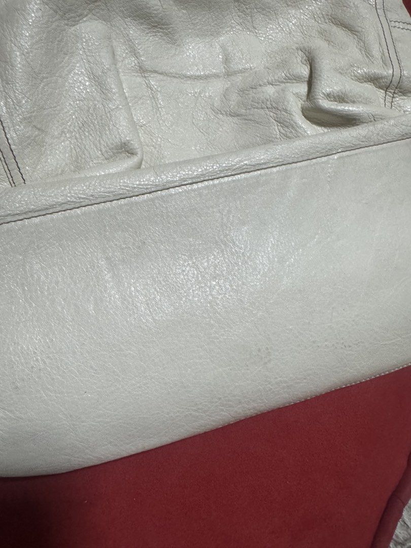 Furla White Leather Braided Handle Shoulder Bag (Category: Luxury Bags & Wallets) located in Quezon City. Submitted by TGDL123 (Listing ID 1442875790, Image 3). Description: - Authentic Furla white leather shoulder bag - Features stylish braided handles - Elegant metal tag with Furla logo - Soft, slouchy leather texture - Ample interior space for essentials - Ideal for everyday wear -Vintage Preloved.