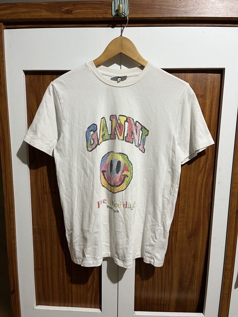 Ganni (Smiley) (Category: Shirts) located in Tayug. Submitted by thriftyshady_ (Listing ID 1449649963, Image 2). Description: Ganni Dimes: 19x26 No issue Condition: 9/10 Color rate: 9/10 Verygood condition.