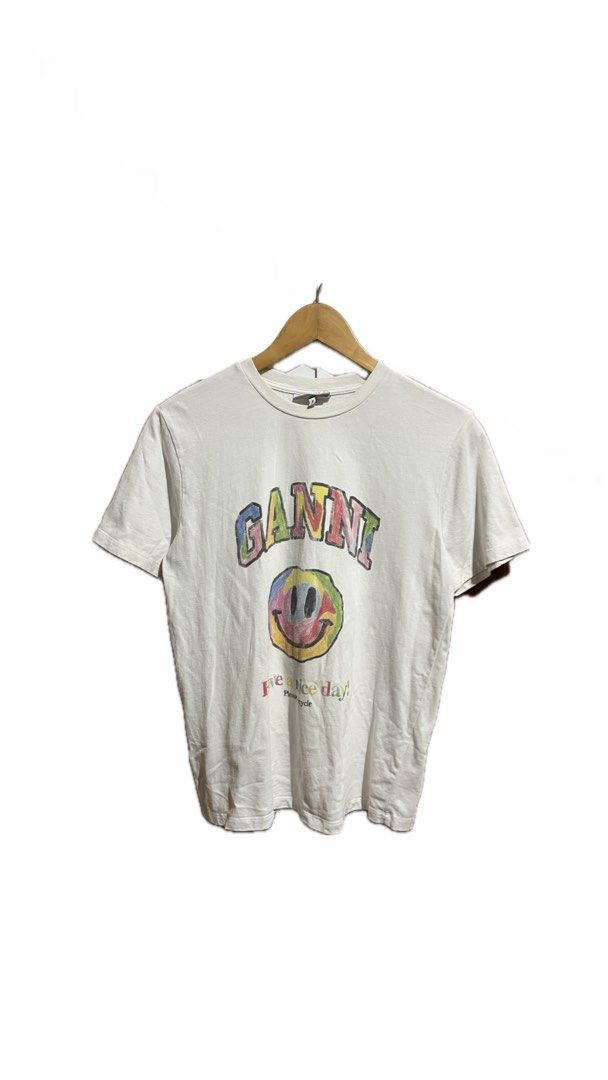 Ganni (Smiley) (Category: Shirts) located in Tayug. Submitted by thriftyshady_ (Listing ID 1449649963, Image 1). Description: Ganni Dimes: 19x26 No issue Condition: 9/10 Color rate: 9/10 Verygood condition.