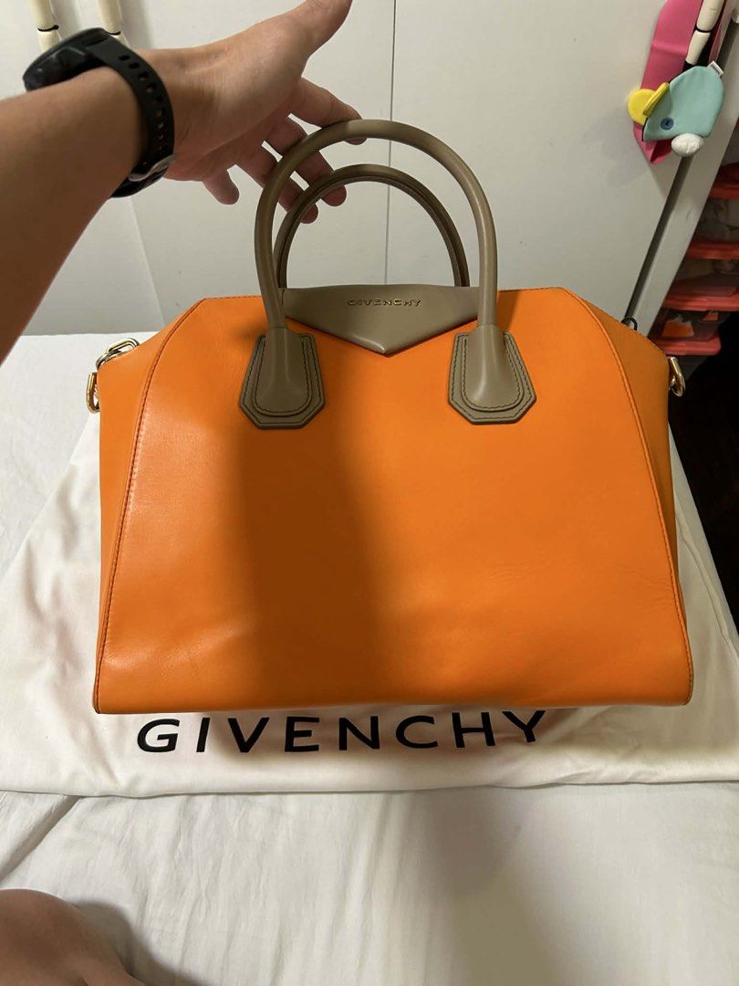 Givenchy Orange Leather Nightingale Bag (Category: Luxury Bags & Wallets) located in Cavite. Submitted by gabrielmontalban (Listing ID 1449634293, Image 1). Description: - Authentic Givenchy Nightingale bag - Vibrant orange leather with tan handles and trim - Comes with original dust bag - Ideal for everyday use, spacious and stylish.