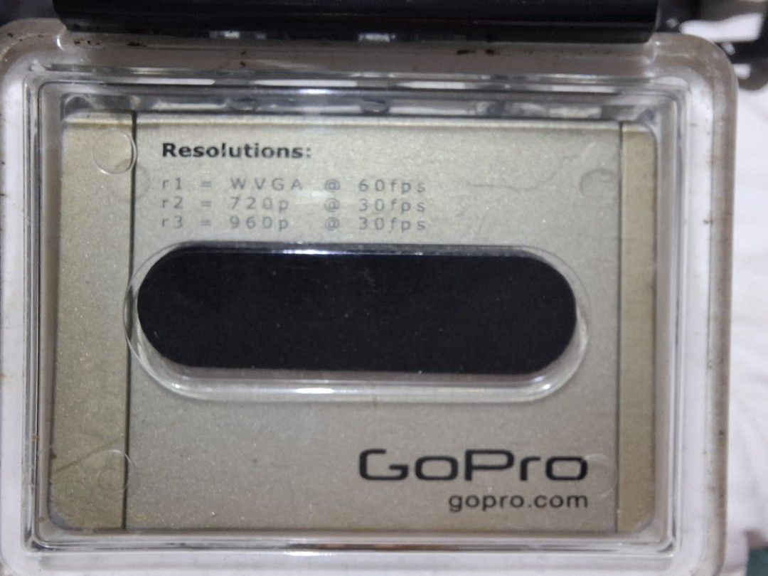 GO PRO ACTION CAMERA (Category: Other Gadgets) located in Carcar. Submitted by brave_brandboss (Listing ID 1449725077, Image 1). Description: GoPro HD HERO (or HD HERO 960) in its standard waterproof polycarbonate housing. Released in the early 2010s, it was one of the brand's first action cameras to shoot high-definition video and features a distinctive gold-colored status LCD front plate. Resolutions: It was capable of shooting up to 1080p at 3