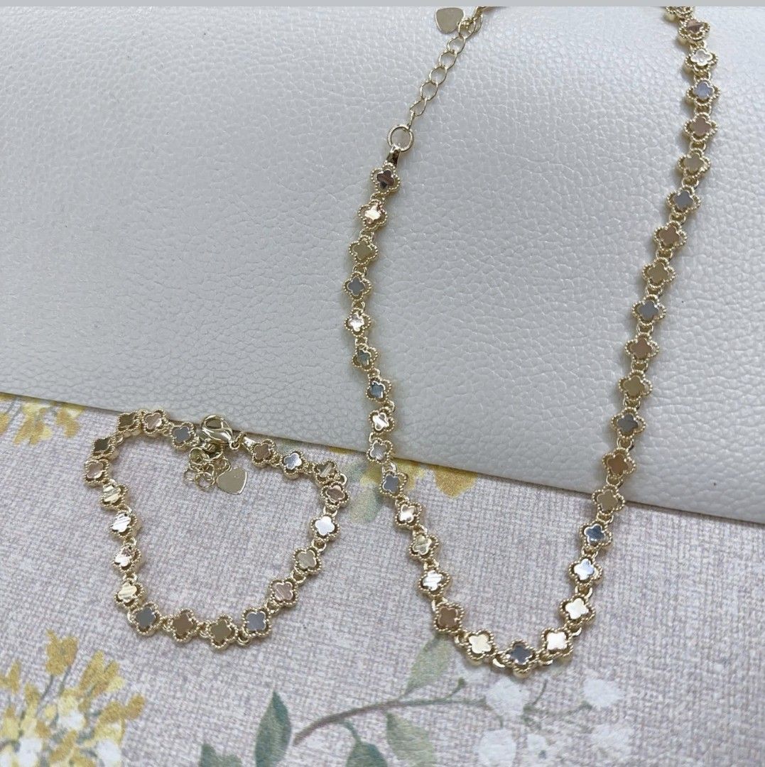 Gold Clover Necklace and Bracelet Set (Category: Necklaces) located in Manila. Submitted by leilei.shopmore (Listing ID 1449599459, Image 1). Description: - Matching gold necklace and bracelet set - Features delicate clover charm design - Necklace has adjustable chain with heart charm - Bracelet is also adjustable -bangkok 18k plated - Ideal for everyday wear or special occasions.