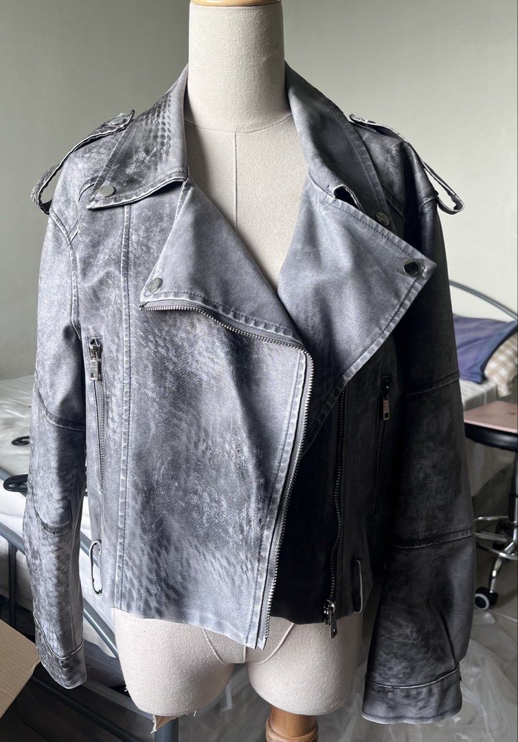 Grey Washed Faux Leather Biker Jacket (Category: Coats, Jackets and Outerwear) located in Makati City. Submitted by spicychickensandwich (Listing ID 1449563371, Image 1). Description: - grey faux leather biker jacket - Washed, distressed look - Asymmetrical zip front - Multiple zip pockets - Snap button lapels and collar.