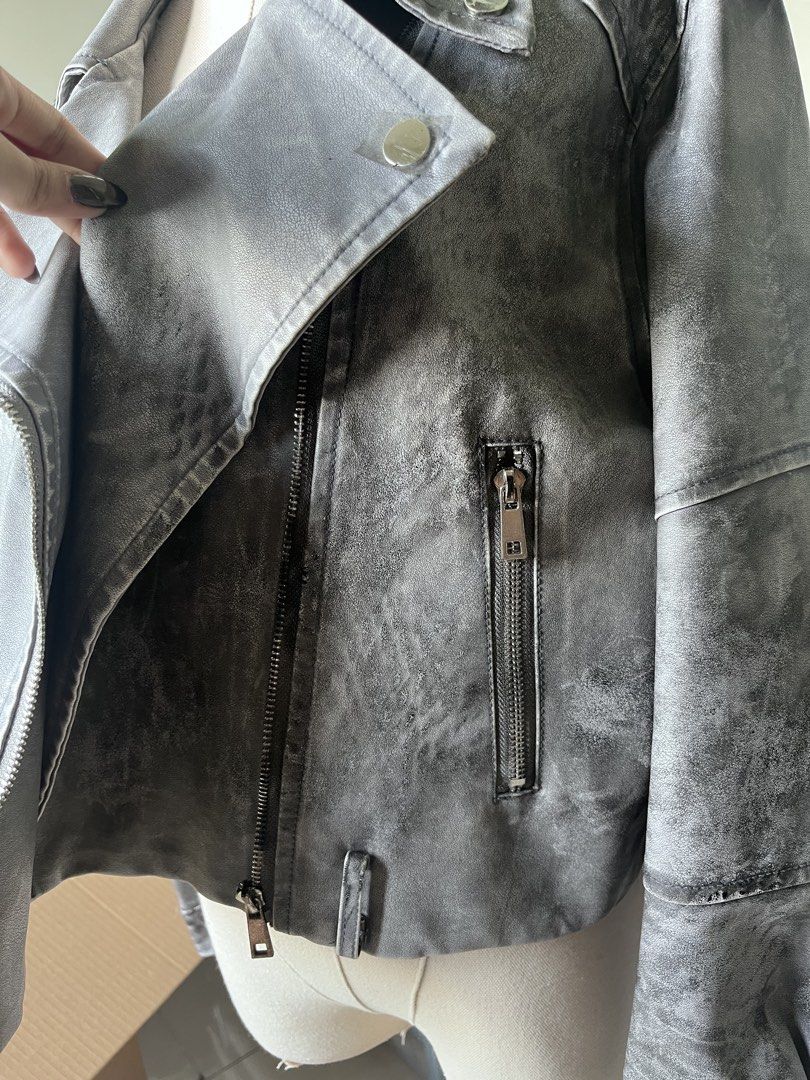 Grey Washed Faux Leather Biker Jacket (Category: Coats, Jackets and Outerwear) located in Makati City. Submitted by spicychickensandwich (Listing ID 1449563371, Image 3). Description: - grey faux leather biker jacket - Washed, distressed look - Asymmetrical zip front - Multiple zip pockets - Snap button lapels and collar.