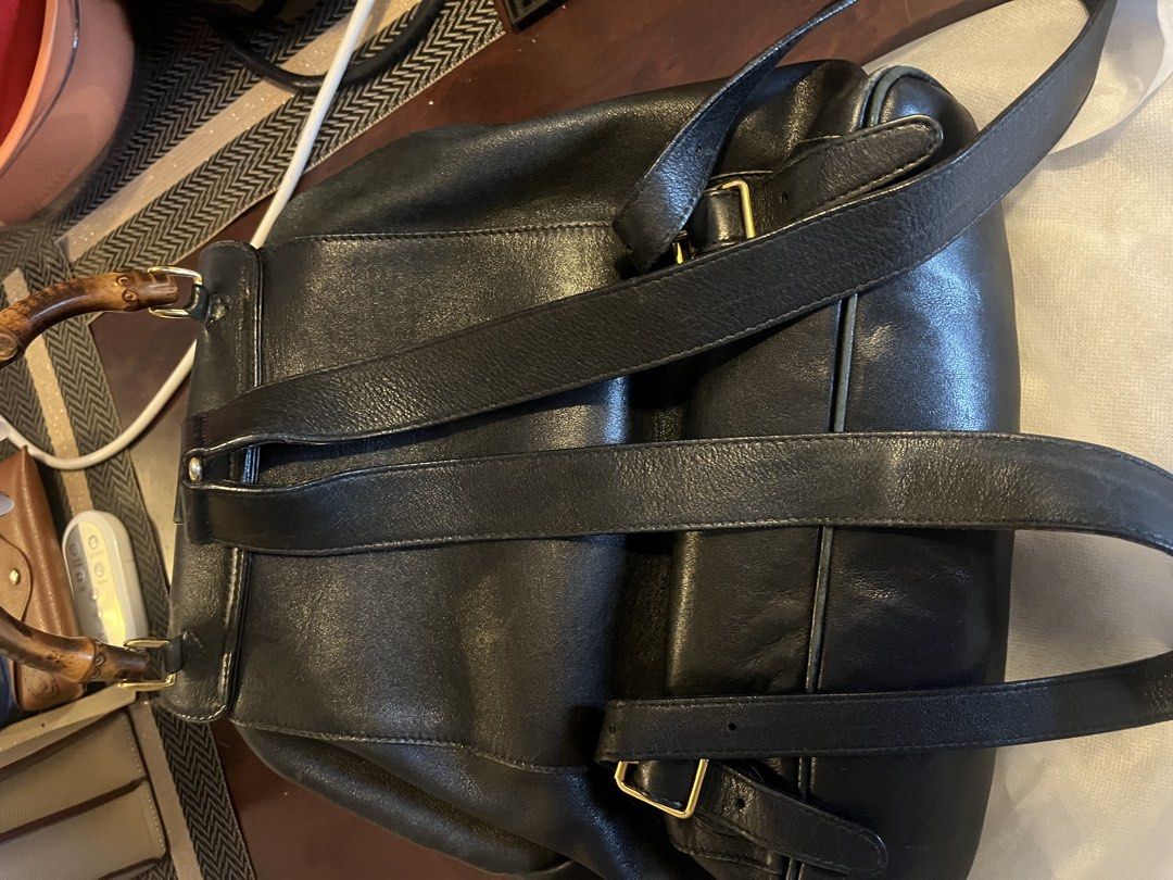 Gucci 2000s Vintage Bamboo Leather Backpack (Category: Backpacks) located in Manila. Submitted by lexa_villanueva (Listing ID 1449551465, Image 2). Description: Highlights: - black - leather - bamboo top handle - two front flap pockets - buckle-fastening front flap - drawstring fastening - adjustable shoulder straps - internal zip-fastening pocket - gold-tone hardware - Condition: GOOD. This previously owned and used item is in good condition wit