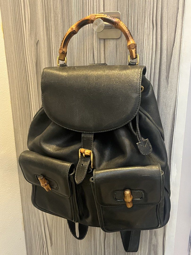 Gucci 2000s Vintage Bamboo Leather Backpack (Category: Backpacks) located in Manila. Submitted by lexa_villanueva (Listing ID 1449551465, Image 1). Description: Highlights: - black - leather - bamboo top handle - two front flap pockets - buckle-fastening front flap - drawstring fastening - adjustable shoulder straps - internal zip-fastening pocket - gold-tone hardware - Condition: GOOD. This previously owned and used item is in good condition wit