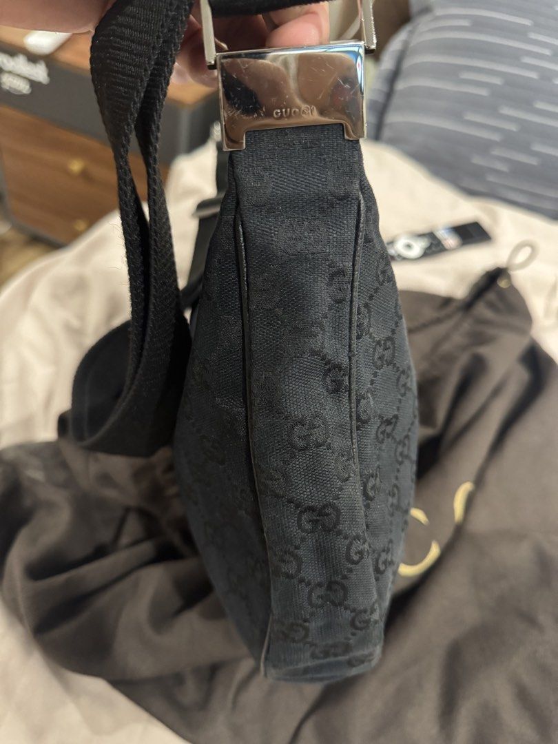Gucci Monogram Shoulder Bag (Category: Luxury Bags & Wallets) located in Caloocan City. Submitted by kolands (Listing ID 1449700519, Image 3). Description: - Authentic Gucci shoulder bag - Black GG monogram canvas - Silver hardware detail on strap - Zipper closure - Comes with original dust bag - Dust bag has some wear and tear Rfs: Not using anymore nag babawas na ng bag.