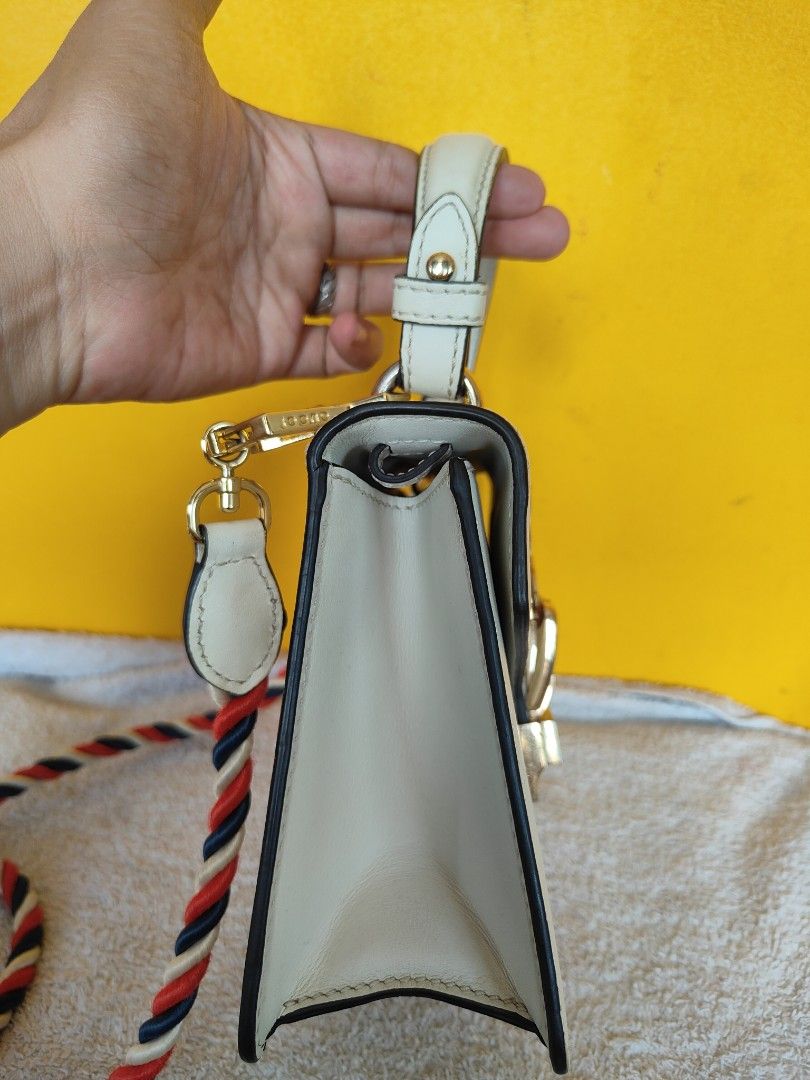 Gucci Sylvie White Leather Top Handle Bag (Category: Luxury Bags & Wallets) located in Cebu City. Submitted by cherreymie70208 (Listing ID 1449536692, Image 3). Description: - White Leather Gucci Sylvie Bag - Features signature green and red web stripe - Elegant gold chain detail - Comes with a detachable shoulder strap for versatility - Interior is clean and well-maintained - Ideal for both daytime and evening wear.