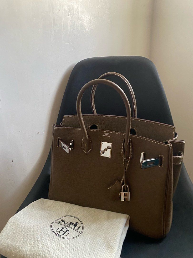 Hermes Birkin 30 Taupe (Category: Luxury Bags & Wallets) located in Las Pinas. Submitted by harper_preloved (Listing ID 1449573224, Image 2). Description: - Birkin size 30 - Color: Taupe - Leather: Togo leather - Hardware: Palladium - Includes: Dust bag .