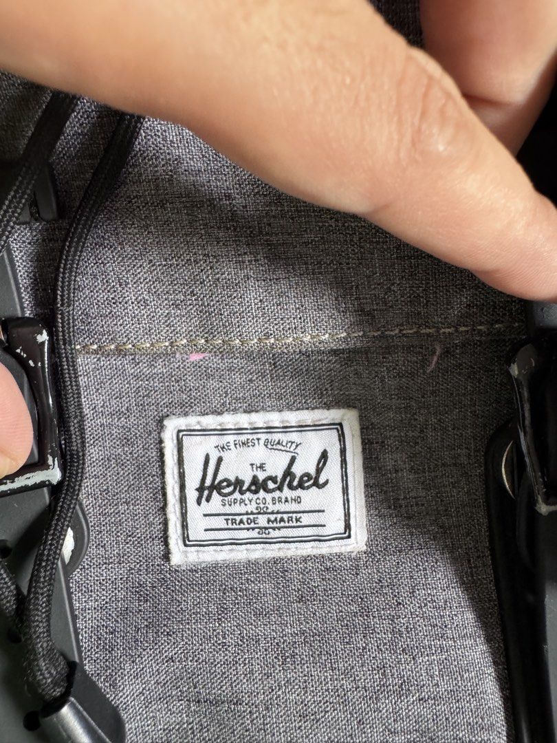 Herschel Supply Co. Grey Backpack (Category: Backpacks) located in Mapandan. Submitted by riadzn (Listing ID 1449557698, Image 3). Description: With signs of usage pero useful parin minimal flaws: one lock sa harap (4th photo) wala na pero may zipper kaya secured parin may blue ballpen ink stain sa loob, nilabhan ko na sya ilang beses pero andun parin, pero sa loob naman kaya hindi kita. overall maganda parin syang gamitin sa school or travel. :)