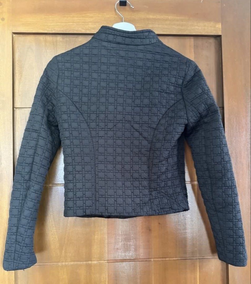 Iconic Quilted Moto Jacket (Category: Coats, Jackets and Outerwear) located in Paranaque City. Submitted by panmakes (Listing ID 1449730376, Image 3). Description: - Iconic black quilted jacket - Cropped length with long sleeves - Asymmetrical zip front - Stand-up collar - Versatile for layering or standalone wear - Sharp and modern look.