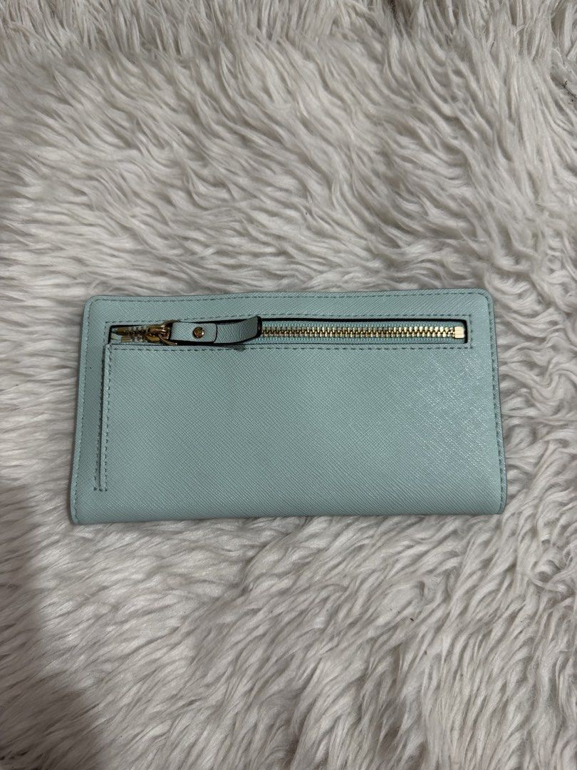 Kate Spade light blue/ aqua , slim, medium bi-fold wallet (Category: Wallets & Card holders) located in Quezon City. Submitted by mariamaharba7798 (Listing ID 1449719820, Image 3). Description: Kate Spade light blue slim bi-fold wallet.