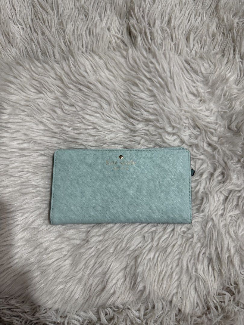 Kate Spade light blue/ aqua , slim, medium bi-fold wallet (Category: Wallets & Card holders) located in Quezon City. Submitted by mariamaharba7798 (Listing ID 1449719820, Image 2). Description: Kate Spade light blue slim bi-fold wallet.