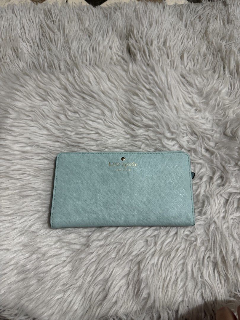 Kate Spade light blue/ aqua , slim, medium bi-fold wallet (Category: Wallets & Card holders) located in Quezon City. Submitted by mariamaharba7798 (Listing ID 1449719820, Image 1). Description: Kate Spade light blue slim bi-fold wallet.