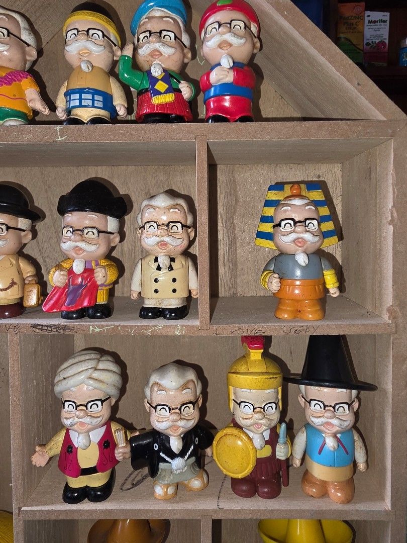 KFC Colonel Sanders (Category: Figurines & Statues) located in Baguio. Submitted by shellcollector (Listing ID 1449594849, Image 3). Description: KFC Colonel Sanders vintage 1999 complete set of 16 figures free wooden display stand 2500 Pesos Baguio shipping.