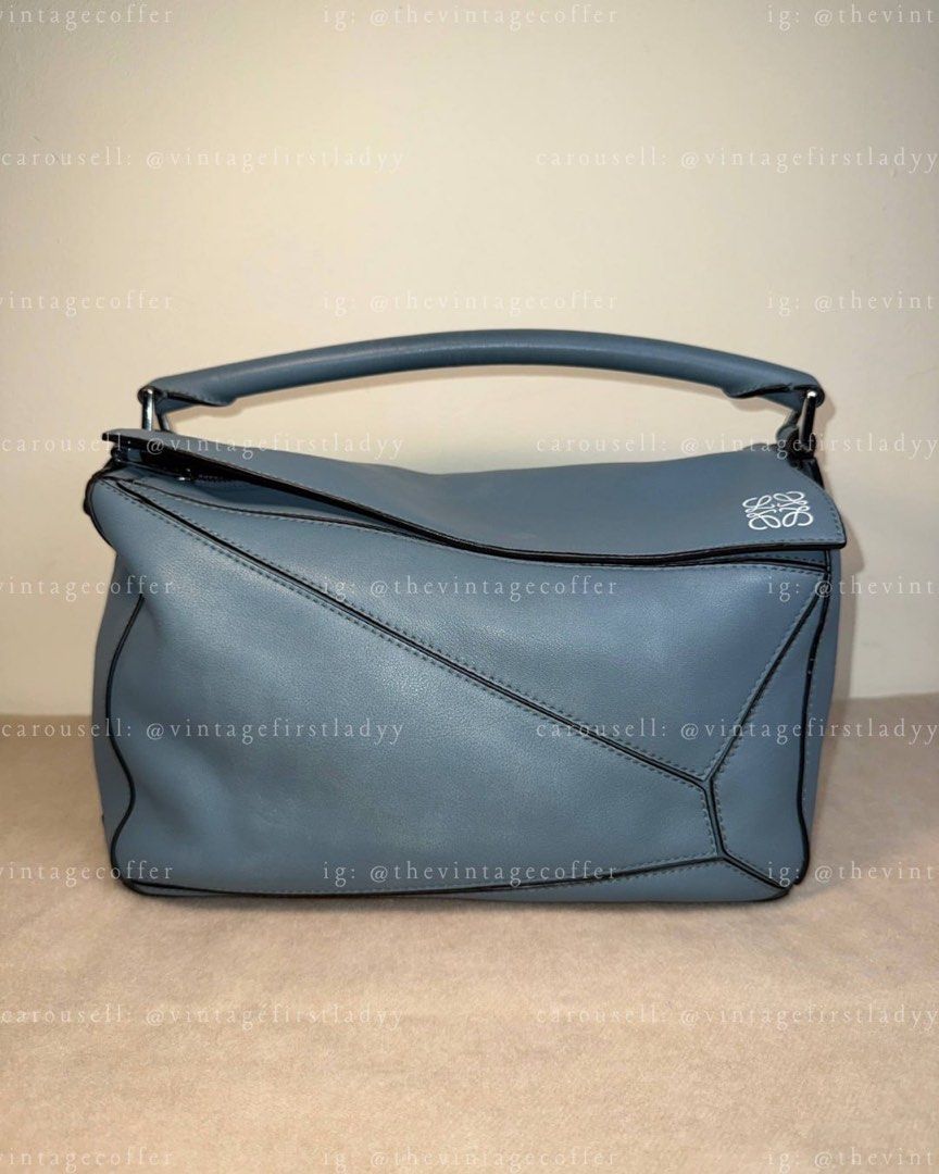 LOEWE Puzzle (Category: Luxury Bags & Wallets) located in Bay. Submitted by thevintagecoffer (Listing ID 1449539261, Image 1). Description: 🏷️ END OF THE MONTH SALE‼️ NO STRAP MEDIUM SIZE!! DIMENSIONS ARE CONSISTENT WITH THE MEDIUM SIZE AS FOUND ON THE OFFICIAL LOEWE PAGE. AUTHENTIC!! money back if proven otherwise within 24 hrs..