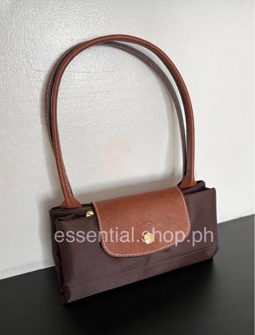 Longchamp Le Pliage LLH Ebony (Category: Luxury Bags & Wallets) located in Manila. Submitted by essential.shop.ph (Listing ID 1403369928, Image 2). Description: FOR PRE-ORDER. 1-2weeks ETA. Longchamp Le Pliage Large Long Handle Ebony Inclusions: LGP zip lock, care card and paper bag Dimensions : 12.2 in (L - measured at the base of the bag) x 11.8 in (H) x 7.5 in (W).