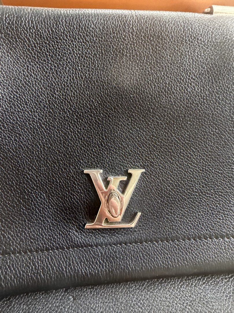 Louis Vuitton (Category: Luxury Bags & Wallets) located in Paranaque City. Submitted by k_martin (Listing ID 1449549103, Image 3). Description: - Authentic Louis Vuitton handbag - Black pebbled leather - Iconic LV logo hardware - Top handle - Detachable strap - Louis Vuitton Paris stamp inside - Comes with dust bag and box.