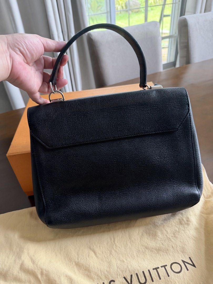 Louis Vuitton (Category: Luxury Bags & Wallets) located in Paranaque City. Submitted by k_martin (Listing ID 1449549103, Image 2). Description: - Authentic Louis Vuitton handbag - Black pebbled leather - Iconic LV logo hardware - Top handle - Detachable strap - Louis Vuitton Paris stamp inside - Comes with dust bag and box.