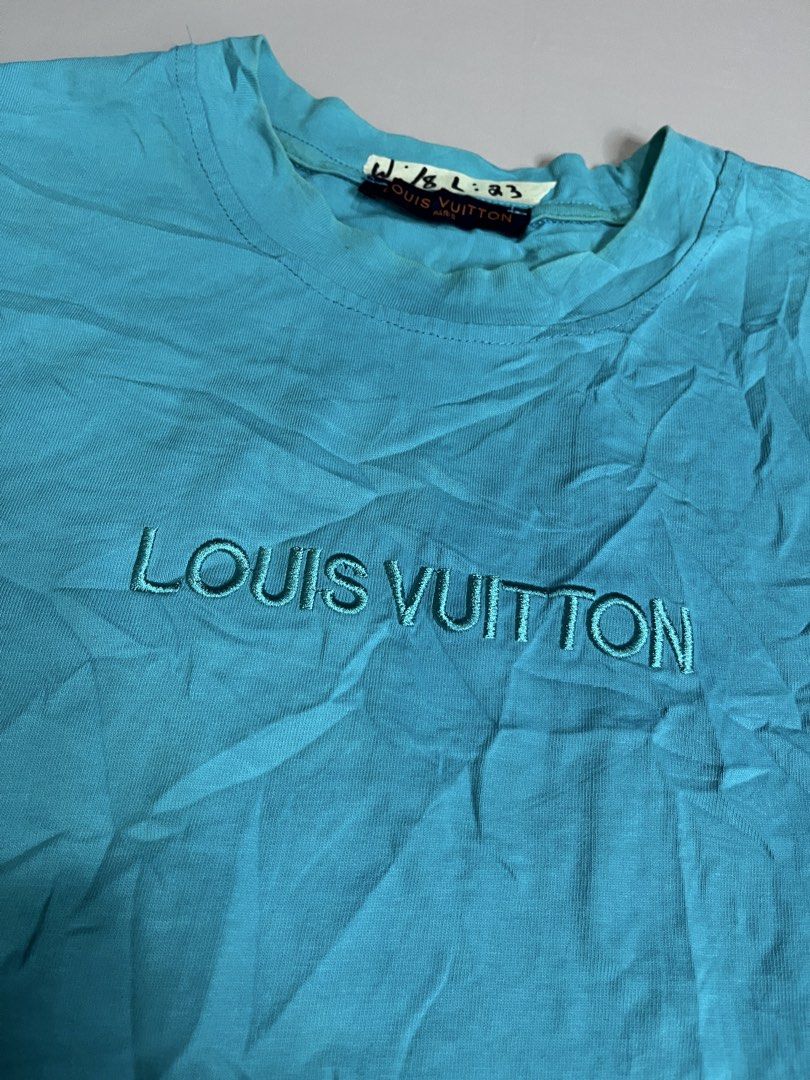 Louis Vuitton Blue Monogram T-Shirt (Category: Luxury Apparel) located in Mabalacat. Submitted by aas_thriftfings (Listing ID 1449681388, Image 2). Description: - Cool blue Louis Vuitton t-shirt - Classic LV monogram embroidered on chest - Tag size: L - Made in Vietnam - Ideal for casual wear.