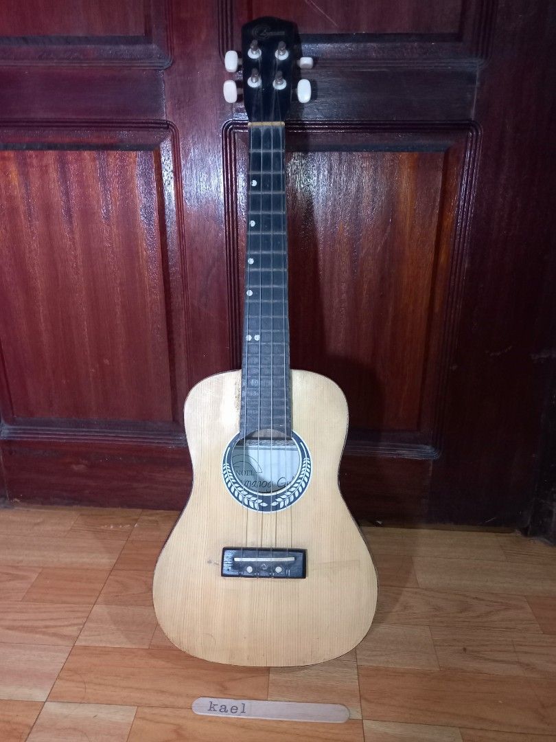 Lumanog Tenor Ukulele (Category: Musical Instruments) located in Taguig. Submitted by kaeltiglao (Listing ID 1449597848, Image 1). Description: This is a Noel Lumanog Tenor Ukulele (~69cm /27in) RFS: decluttering and need funds for college Specs: Body: laminated plywood Strings: Last restring was June 2024 (Standard GCEA strings) Note: ❗️There are light scratches all throughout the body and some wood chipping around the seams but it does not affe