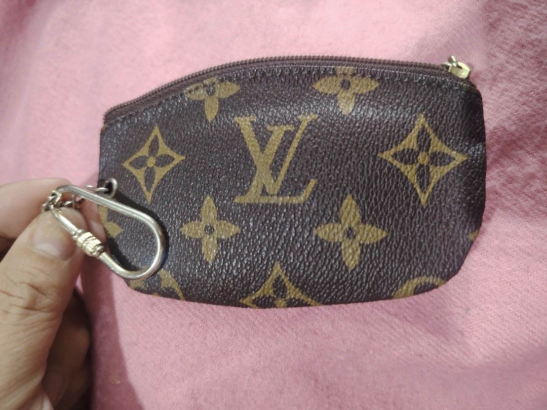 LV coin purse (Category: Luxury Bags & Wallets) located in Malolos. Submitted by shoptokyothrift (Listing ID 1449565634, Image 3). Description: Louis Vuitton Monogram Key Pouch / Coin Purse ✨ Classic Louis Vuitton Monogram coated canvas ✨ Zip-top closure ✨ Silver-tone key chain & hook ✨ Perfect for coins, folded cash, keys, earbuds, or small essentials ✨ Pre-loved condition with normal signs of use.