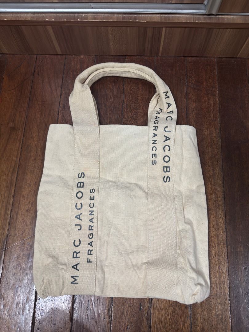 Marc Jacobs Fragances Canvas Tote Bag (Category: Tote Bags) located in Quezon City. Submitted by declutterwithsk (Listing ID 1449635513, Image 3). Description: ✨ Marc Jacobs Frances Canvas Tote Bag with Pins ₱2,500 Selling my brand new Marc Jacobs Frances Canvas Tote Bag with Pins. Never used. It has a few light yellowish stains on the back due to storage, but the overall condition is still excellent. ✅ Inclusions: — Tote bag with decorative pins