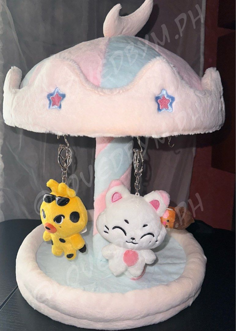 Merry-Go-Round Carousel Plushie Keychain Display (Category: Other Home Decor) located in Taguig. Submitted by lovedbym.sell (Listing ID 1449611929, Image 2). Description: merry-go-round carousel rotating keychain plushie display stand 45 cm w/ 6 magnetic hooks ❕preferably within metro manila para lalamove kasi malaki yan sha ❗️plushies NOT included (for size comparison only).