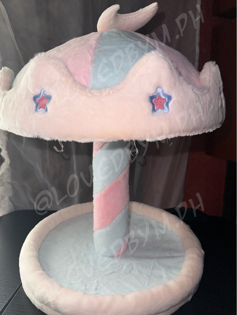 Merry-Go-Round Carousel Plushie Keychain Display (Category: Other Home Decor) located in Taguig. Submitted by lovedbym.sell (Listing ID 1449611929, Image 1). Description: merry-go-round carousel rotating keychain plushie display stand 45 cm w/ 6 magnetic hooks ❕preferably within metro manila para lalamove kasi malaki yan sha ❗️plushies NOT included (for size comparison only).