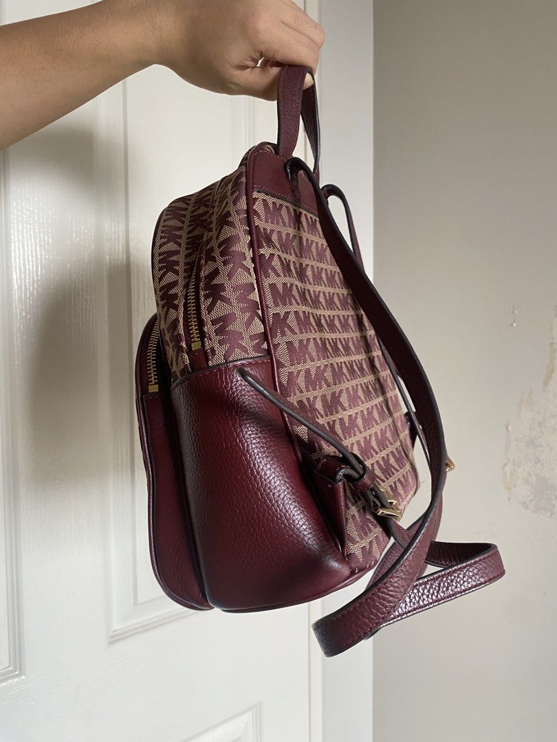 Michael Kors Abbey MD Backpack (Category: Luxury Bags & Wallets) located in Manila. Submitted by jellae (Listing ID 1449625479, Image 3). Description: - Authentic Michael Kors Abbey Backpack - Signature MK print in burgundy and beige - Genuine leather trim - Adjustable straps for comfort - Comes with original tag, with dust bag Used less than 5 times :).