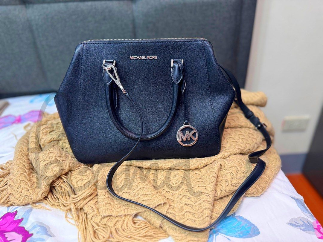 Michael Kors Charlotte Satchel Black (Category: Luxury Bags & Wallets) located in Quezon City. Submitted by warmbear.c1d0c5 (Listing ID 1449695503, Image 2). Description: - Michael Kors Charlotte Satchel in classic Black. - Purchased in 2022 via IG Pasabuy. - Original strap included. - Comes with a generic dust bag. - Selling due to decluttering and upcoming immigration..