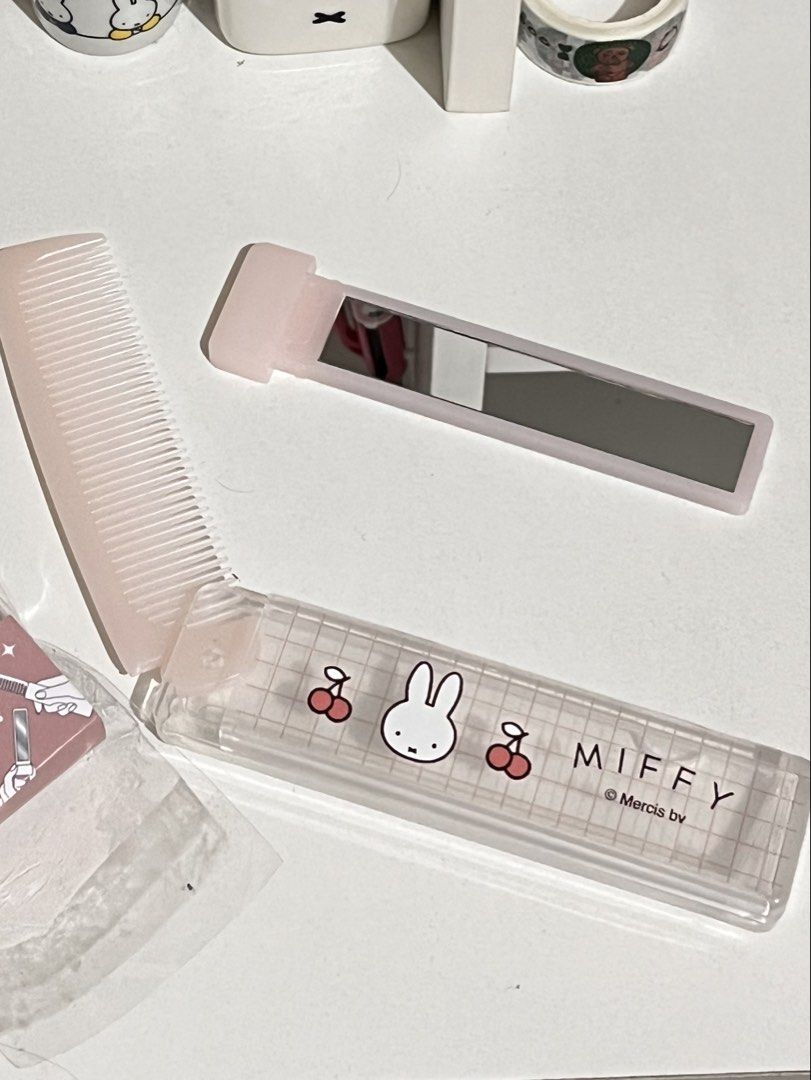 Miffy Folding Comb and Mirror Set Pink Cherry Blossom (Category: Mirrors) located in San Antonio. Submitted by butter.miff (Listing ID 1449686169, Image 2). Description: - Adorable Miffy folding comb and mirror set - Pretty pink color with cherry blossom design - Ideal for quick touch-ups anytime, anywhere - Compact and travel-friendly - A must-have for any Miffy enthusiast!.