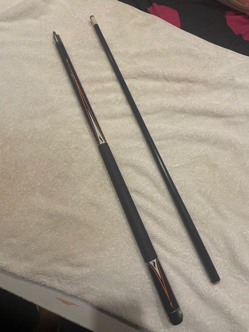 Mizerak Pool Cue Stick (Category: Billiards and Bowling) located in Pasig City. Submitted by carlrd (Listing ID 1449712002, Image 3). Description: 🎱 Mizerak 2-Piece Pool Cue Stick – Good Condition Details: * ✅ Brand: Mizerak * ✅ 2-piece cue for easy transport and storage * ✅ Comfortable black grip wrap * ✅ Black shaft with black/orange/white graphic design * ✅ Straight and plays well * ✅ Good overall condition with normal signs of use Well-maint