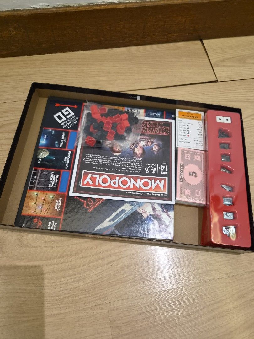 Monopoly Stranger Things Edition Board Game (Category: Board Games & Puzzles) located in Las Pinas. Submitted by janabriz (Listing ID 1449587965, Image 3). Description: - Monopoly Stranger Things Edition Board Game - Features iconic characters and locations from the show - Includes: Game board, tokens, cards, and money - Fun for fans of the Stranger Things series - Great for family game nights and gatherings.