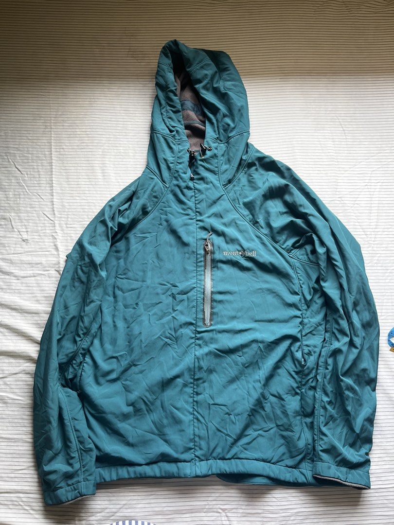 Montbell Teal Hooded Lightweight Jacket Size L (Category: Hiking & Camping) located in Bacoor. Submitted by _laiii (Listing ID 1449575880, Image 1). Description: - Teal Montbell hooded jacket; fleece material inside - Size: Large (L) - Measurements: Pit to pit approx. 22 inches, Length approx. 27 inches Minor issues: may chipped parts sa front pocket zipper; left pocket zipper can barely open na but all in all still good.