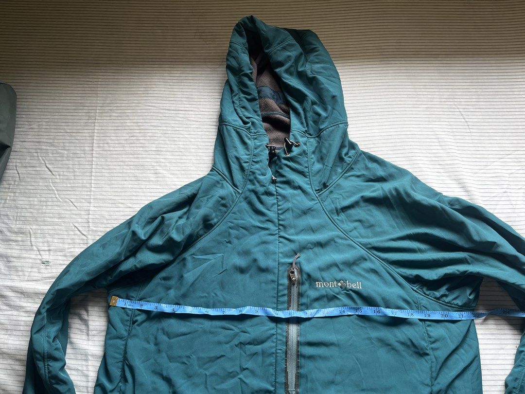 Montbell Teal Hooded Lightweight Jacket Size L (Category: Hiking & Camping) located in Bacoor. Submitted by _laiii (Listing ID 1449575880, Image 2). Description: - Teal Montbell hooded jacket; fleece material inside - Size: Large (L) - Measurements: Pit to pit approx. 22 inches, Length approx. 27 inches Minor issues: may chipped parts sa front pocket zipper; left pocket zipper can barely open na but all in all still good.