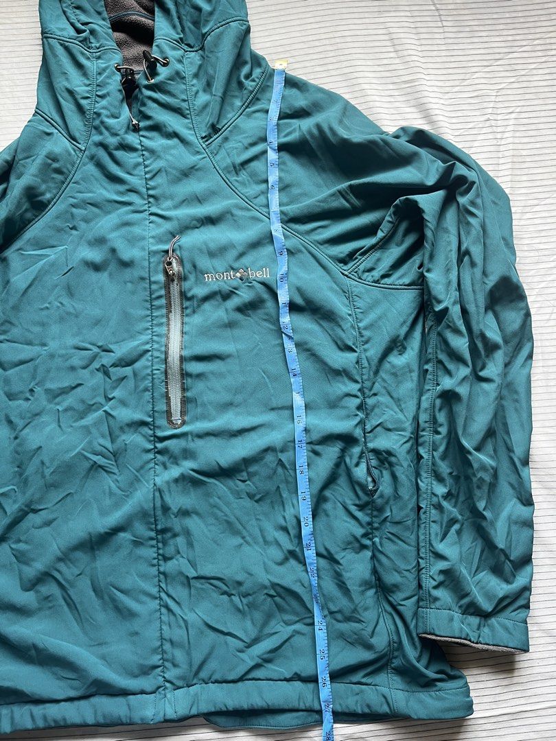 Montbell Teal Hooded Lightweight Jacket Size L (Category: Hiking & Camping) located in Bacoor. Submitted by _laiii (Listing ID 1449575880, Image 3). Description: - Teal Montbell hooded jacket; fleece material inside - Size: Large (L) - Measurements: Pit to pit approx. 22 inches, Length approx. 27 inches Minor issues: may chipped parts sa front pocket zipper; left pocket zipper can barely open na but all in all still good.