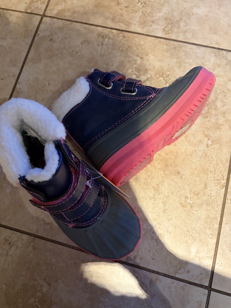 New size 9 winter boots (Category: Girl's Apparel) located in Toronto. Submitted by springcleaning99 (Listing ID 1449685739, Image 2). Description: These are Gymboree girls’ winter boots in size 9. They’re navy blue and grey with pink accents and white fuzzy lining. These boots are great for keeping little feet warm and dry in the snow! New from a pet and smoke free home. .