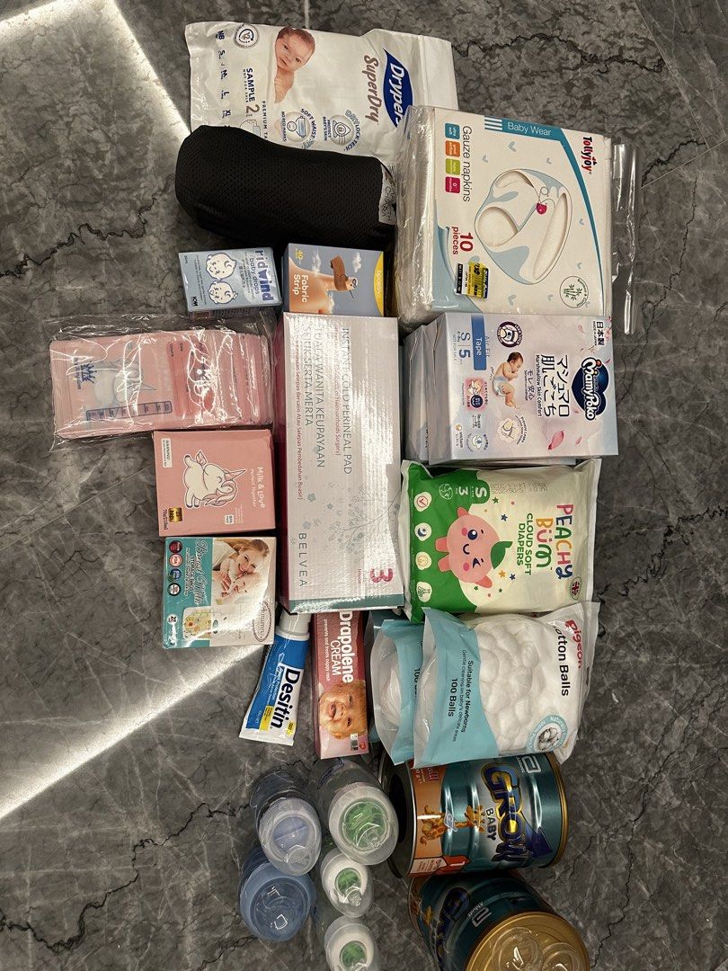 Newborn Bundle (Category: Breastfeeding & Bottle Feeding) located in Singapore. Submitted by declantan07 (Listing ID 1449674875, Image 1). Description: Carrier/Wrap • Japheth Chiara baby wrap (retail $79) — barely used Bottles • Dr. Brown’s anti-colic bottles x3 • NUK glass bottle (anchor design) x1 • NUK bottle (blue, animal print) x1 • Spare NUK anti-colic inserts x4 + spare teat x1 Formula (unopened) • Growing Up Milk formula tins x2 Diapers •