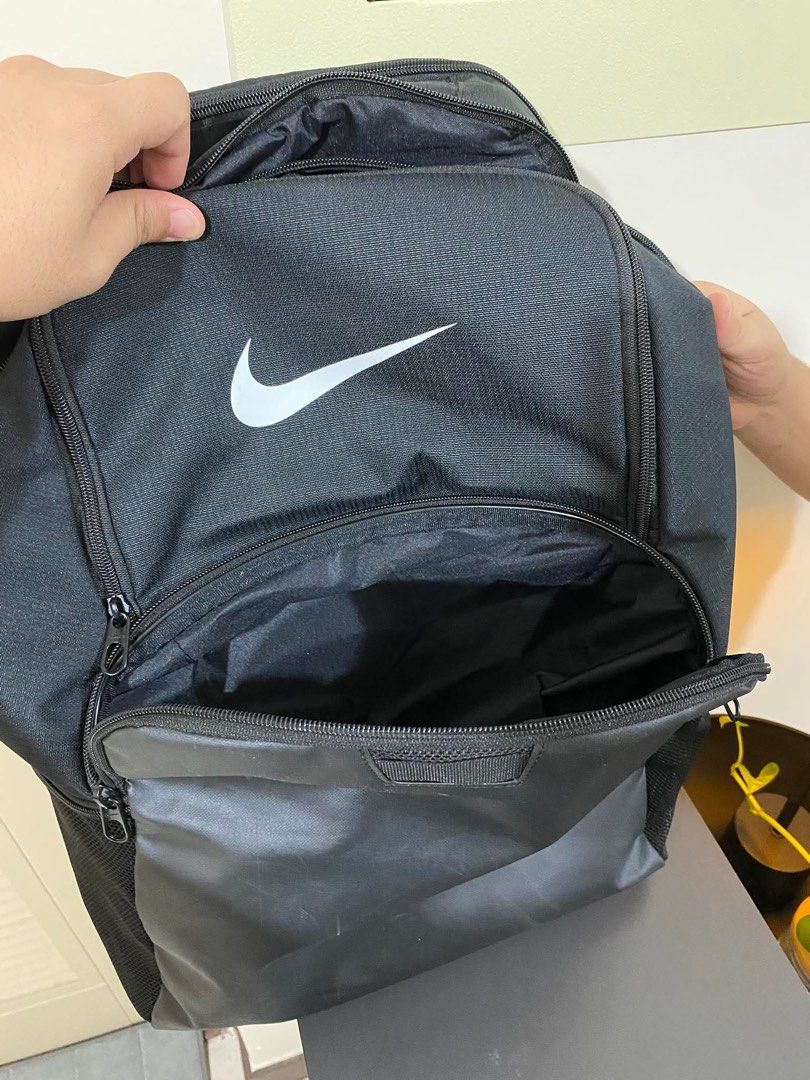Nike Black Backpack (Category: Backpacks) located in Manila. Submitted by eymeymey (Listing ID 1449684340, Image 2). Description: - Black Nike backpack - Main compartment for essentials - Front pocket for quick access - Side mesh pockets for water bottles - Zippers are in great working condition - Spacious interior, perfect for school or gym gear - L 18inches x W 16inches.