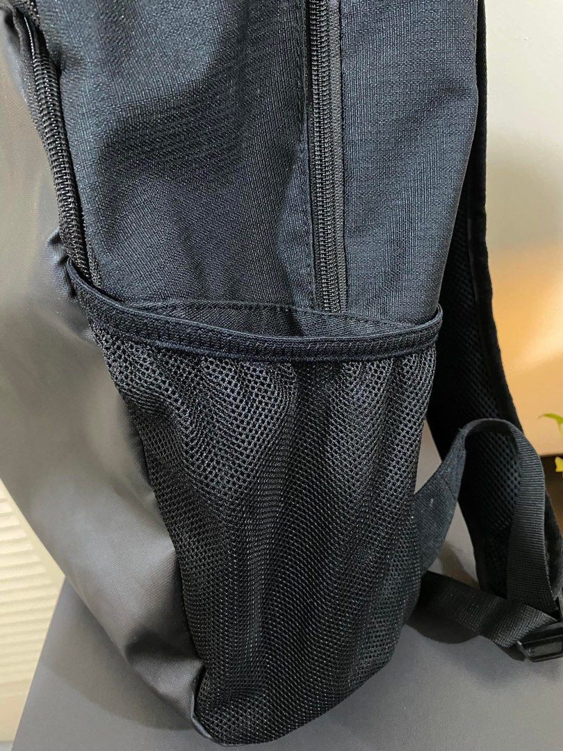 Nike Black Backpack (Category: Backpacks) located in Manila. Submitted by eymeymey (Listing ID 1449684340, Image 3). Description: - Black Nike backpack - Main compartment for essentials - Front pocket for quick access - Side mesh pockets for water bottles - Zippers are in great working condition - Spacious interior, perfect for school or gym gear - L 18inches x W 16inches.